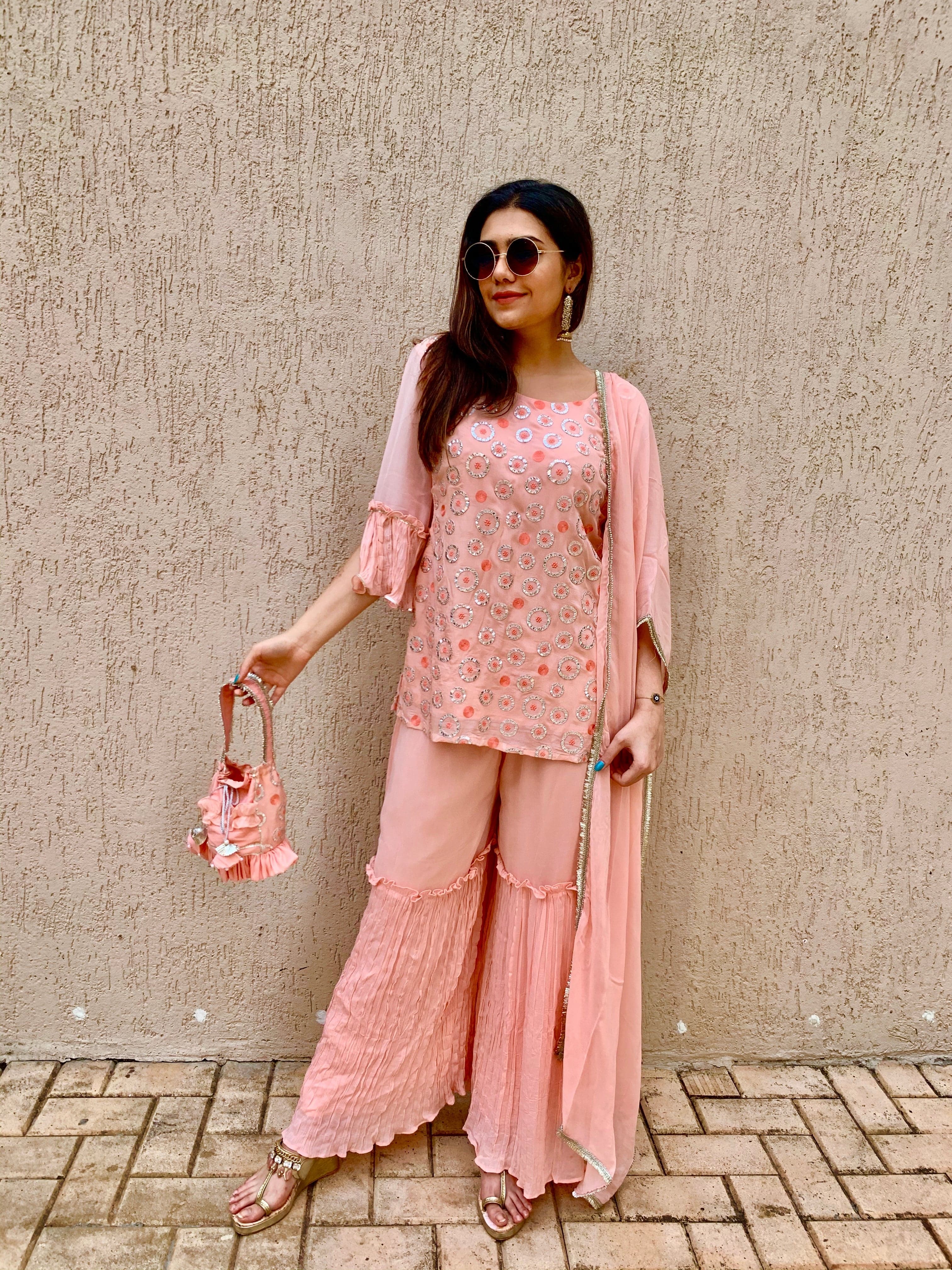 Peach Embroidered Sharara set with matching Potli